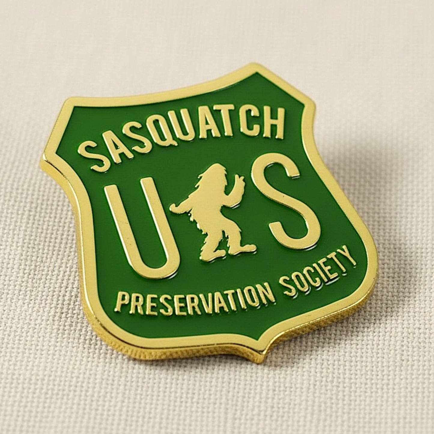 Sasquatch US Preservation Society badge on a beige background