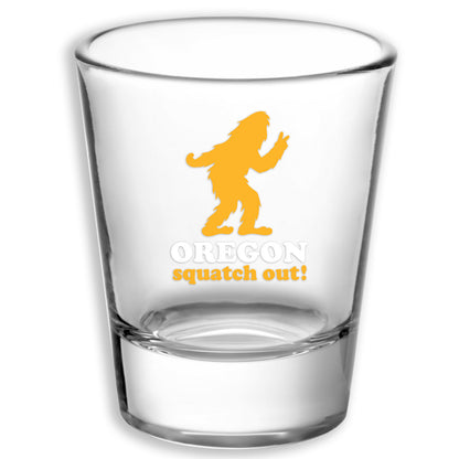 Squatch Out Oregon Bigfoot | Shot Glass featuring a clear glass design with a yellow Bigfoot silhouette and Oregon squatch out lettering, an Oregon Bigfoot shot glass